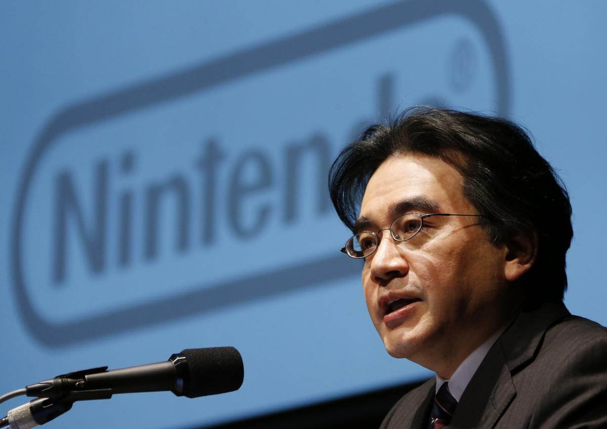 Former Nintendo president Satoru Iwata speaks during a news conference in Tokyo. The videogame designer and businessman died in 2015 of a bile duct tumour