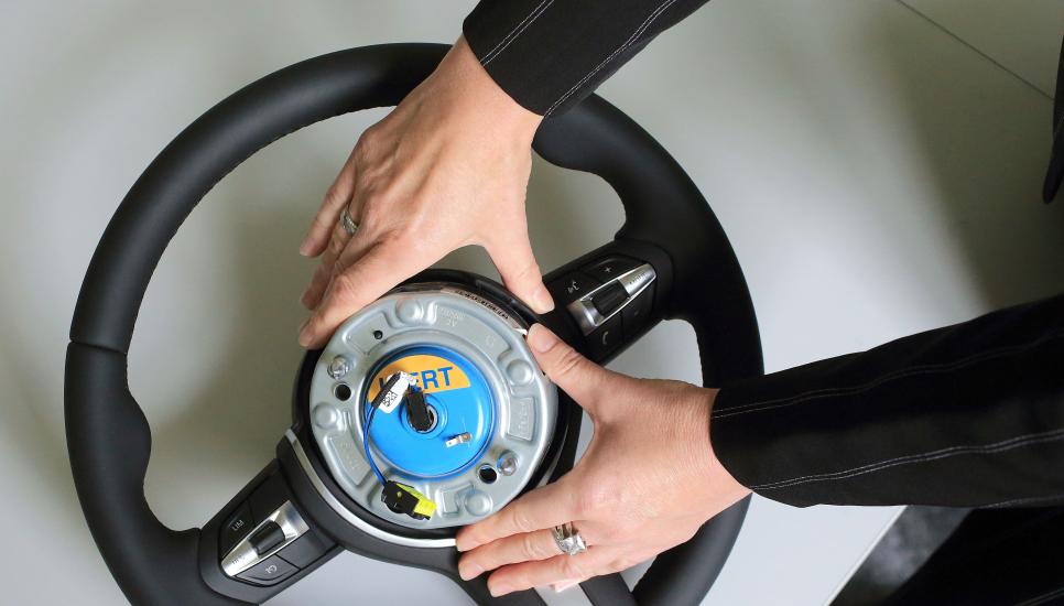 An airbag igniter is built into a steering wheel for a car at the Takata Ignition Systems Gmbh factory in Germany in 2014.