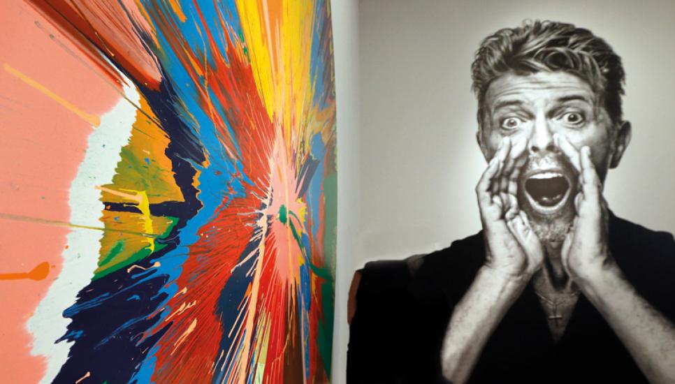 Damien Hirst's spin painting beside the Bowie portrait by Gavin Evans - Ph: Press Association