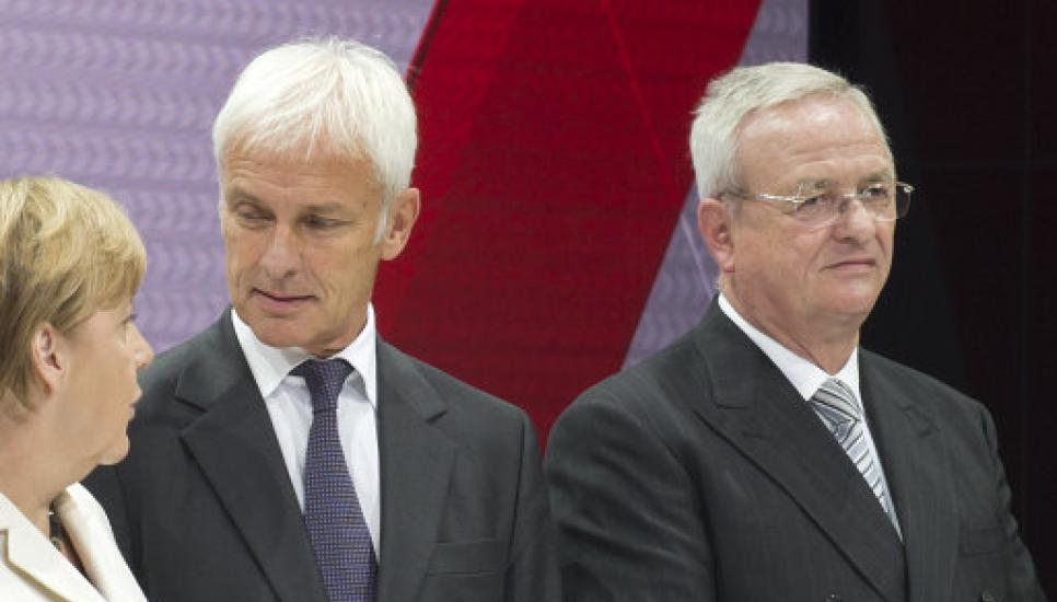Martin Winterkorn (right) at last week's Frankfurt Auto Show. He stands beside Matthias Mueller, his rumoured replacement, and German chancellor Angela Merkel