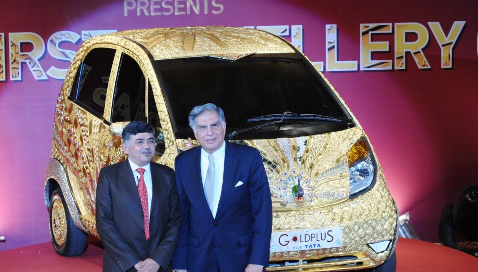 Ratan Tata, head of Tata Group, and Bhaskar Bhatt, managing director of Titan Industries (a subsidiary) unveil the golden car